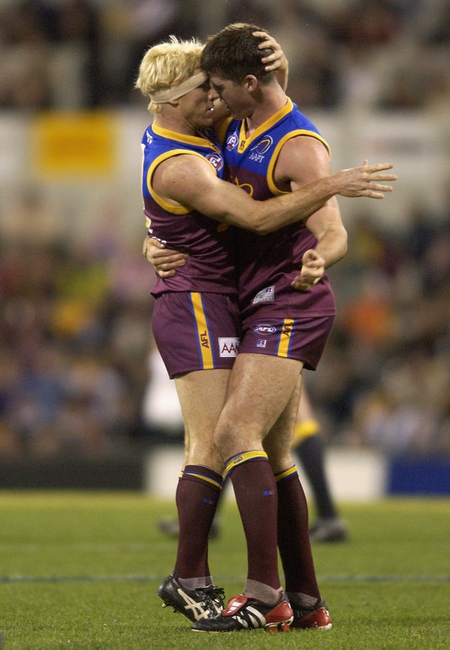 AFL 2002 Rd 20 - Brisbane v West Coast Jason Akermanis of the Lions celebrates kicking a goal with team mate Jonathan Brown during the round 20 AFL match between the Brisbane Lions and the West Coast Eagles at the Gabba in Brisbane, Australia on August 17, 2002.